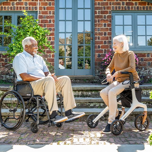 Two people in wheelchairs